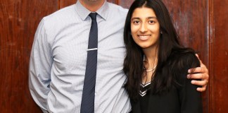 North High School junior Preethi Kumar is congratulated by Principal Daniel Holtzman for being recognized by the Anti-Defamation League. (Photo courtesy of Great Neck Public Schools)