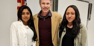 Jakeline Arevalo and Melissa Ceron are congratulated by South High guidance counselor Christopher Erickson. (Photo courtesy of Great Neck Public Schools)