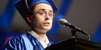 David Carbone, the "voice of Great Neck South High School," took a moment to honor the legacy of the late Sally Passarella, who he said changed his life, at commencement. (Photo by Janelle Clausen)