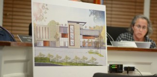 A rendering of the proposed recreational center for the United Mashadi Jewish Community of America sits in front of the Village of Great Neck Board of Trustees. (Photo by Janelle Clausen)