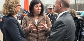 Nassau County District Attorney Madeline Singas of Manhasset, center, speaks with Nassau County Executive Laura Curran and Nassau County Police Commissioner Patrick Ryder after a press conference in 2018 about opioid overdoses. (Photo by Amelia Camurati)