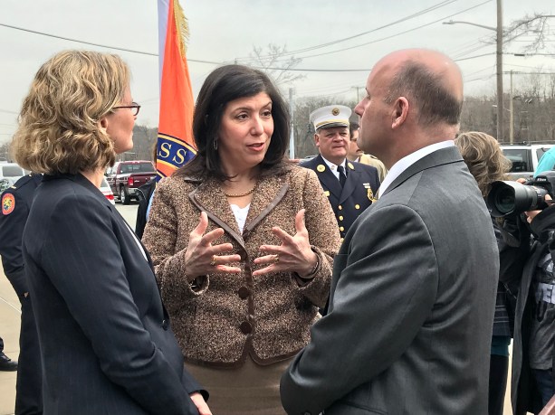 Nassau County District Attorney Madeline Singas of Manhasset, center, speaks with Nassau County Executive Laura Curran and Nassau County Police Commissioner Patrick Ryder after a press conference in 2018 about opioid overdoses. (Photo by Amelia Camurati)