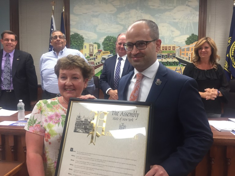 NHP honors board secretary for ‘Community Day’ work NHP honors board secretary for ‘Community Day’ work