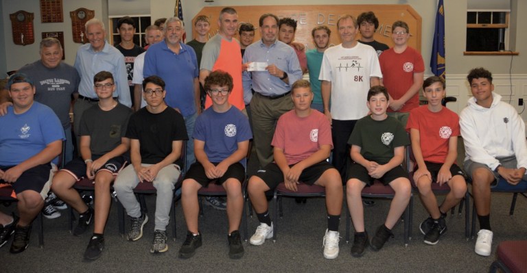 The New Hyde Park-Mineola Runners Club Donates $500 to the Mineola Junior Fire Department