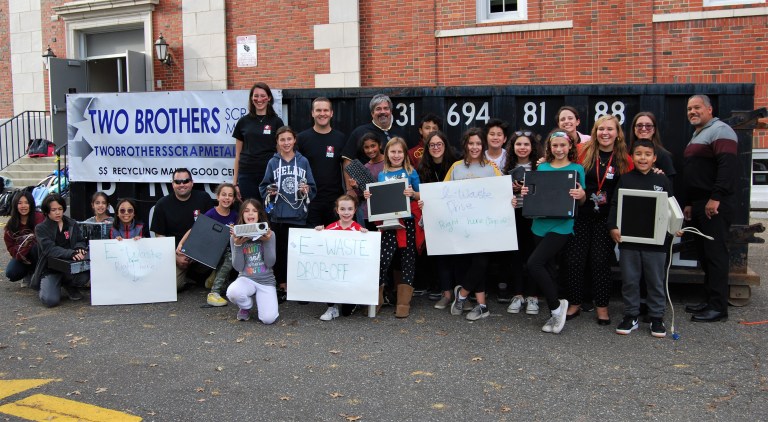 Two Brothers Scrap Metal helps out at Mineola Middle School’s eWaste Drive