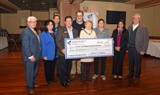 NHP chamber gives $500 to Melanoma fight