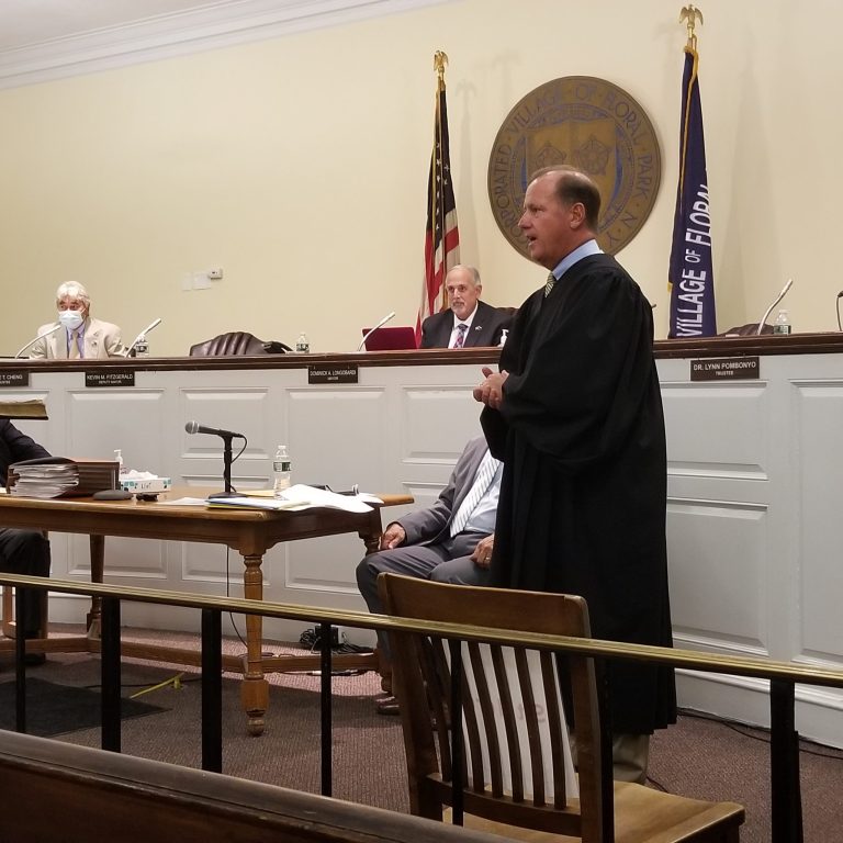 Judge Doug Hayden swears in new court clerk, Joan McAllister