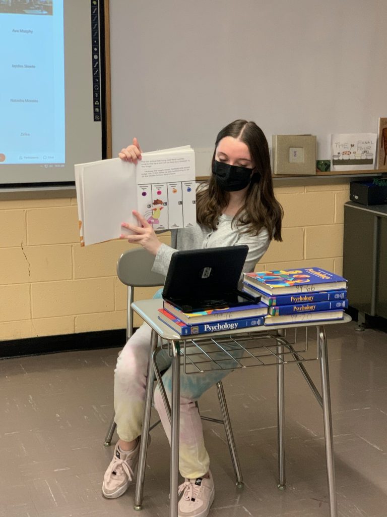 Mineola High School students connect with second graders through reading