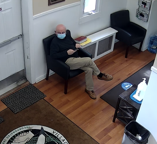 Gerard Terry visited Manorhaven Village Hall on March 24, according to surveillance video and other sources. (Screencap from Manorhaven surveillance video)