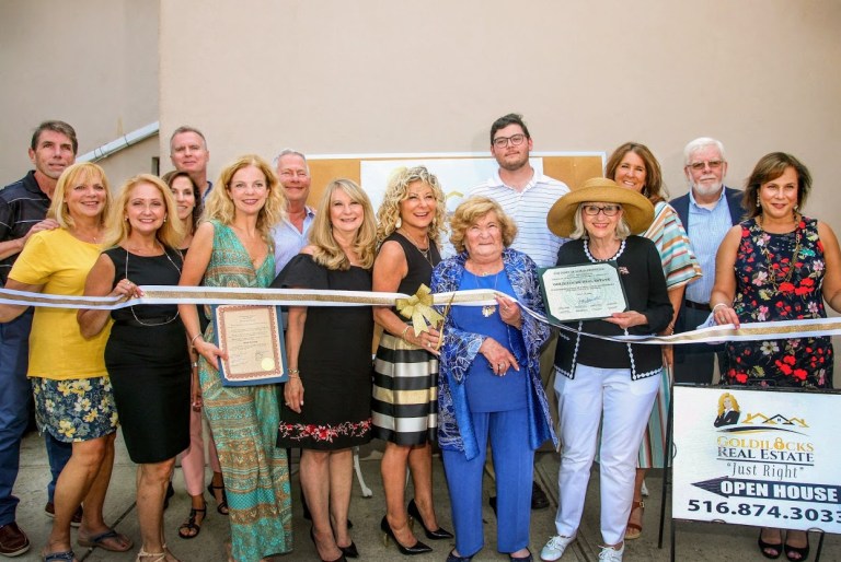 Town supervisor attends five-year anniversary ribbon cutting of Goldilocks Real Estate