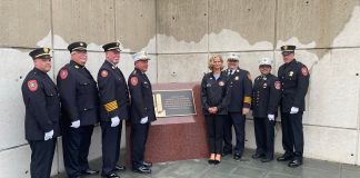 Nassau County Executive Laura Curran and fire officials pose alongside the newly unveiled First Responders Memorial. (Photo by Brandon Duffy)