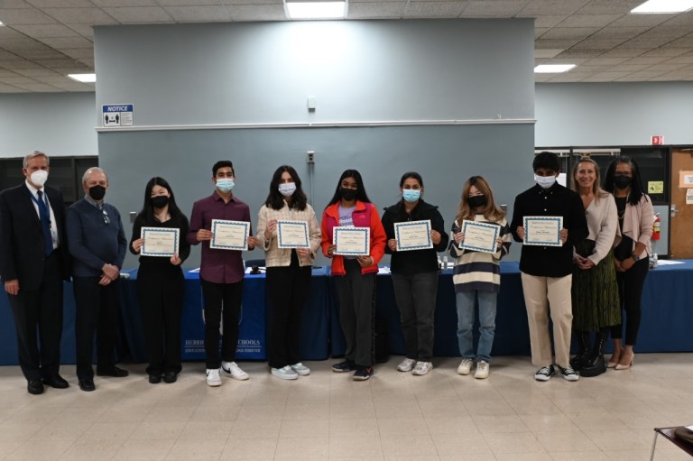 Nine Herricks National Merits Finalists recognized at board meeting