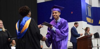 Sewanhaka High School's principal Nichole Allen personally delivering certificates to the graduating class of 2022.