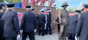 21 of the 38 50-year members unveiling the memorial wall.