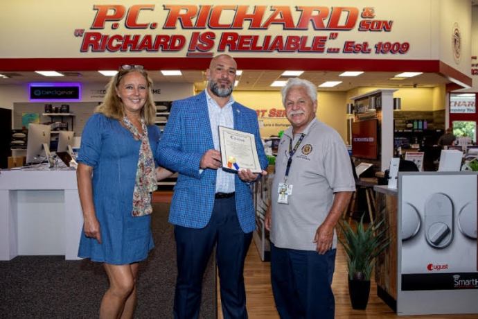 Nassau County Legislator Delia DeRiggi-Whitton (left), P.C. Richard & Sons Sales Director Joe Morrone (center), and Nassau County Veterans Service Agency Director Ralph Esposito (right).