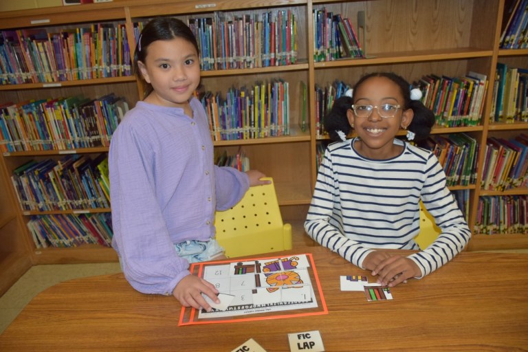 Students learn and read in the library at Floral Park-Bellerose’s John Lewis Childs School
