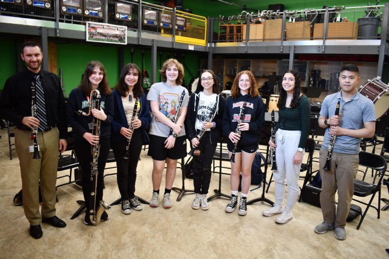 Mineola High School Wind Ensemble performs with U.S. Marine Band member