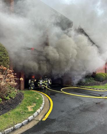 Manhasset-Lakeville firefighters responding to a garage fire on Thursday, Dec. 28. (Photo courtesy of the Manhasset-Lakeville Fire Department)