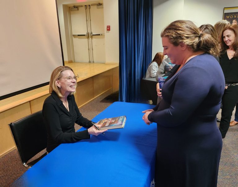 Author Fiona Davis signs books at the Mineola Library