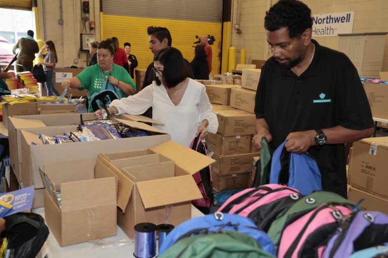 Northwell staff packs over 2,800 book bags for students