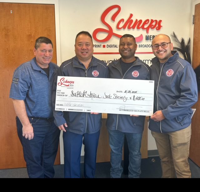 Schneps Media, Bethpage Federal Credit Union present Suffolk County police society with $1.7K